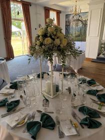 All white table arrangement on stand 
