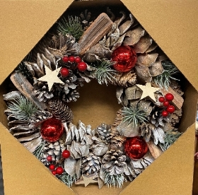 Natural effect wreath with red berries